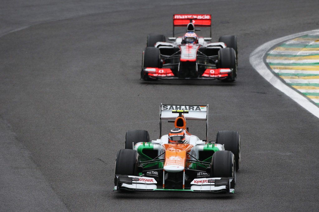 Nico Hulkenberg (GER) Sahara Force India F1 VJM05 leads the race from Jenson Button (GBR) McLaren MP4/27. Brazilian Grand Prix, Sunday 25th November 2012. Sao Paulo, Brazil.