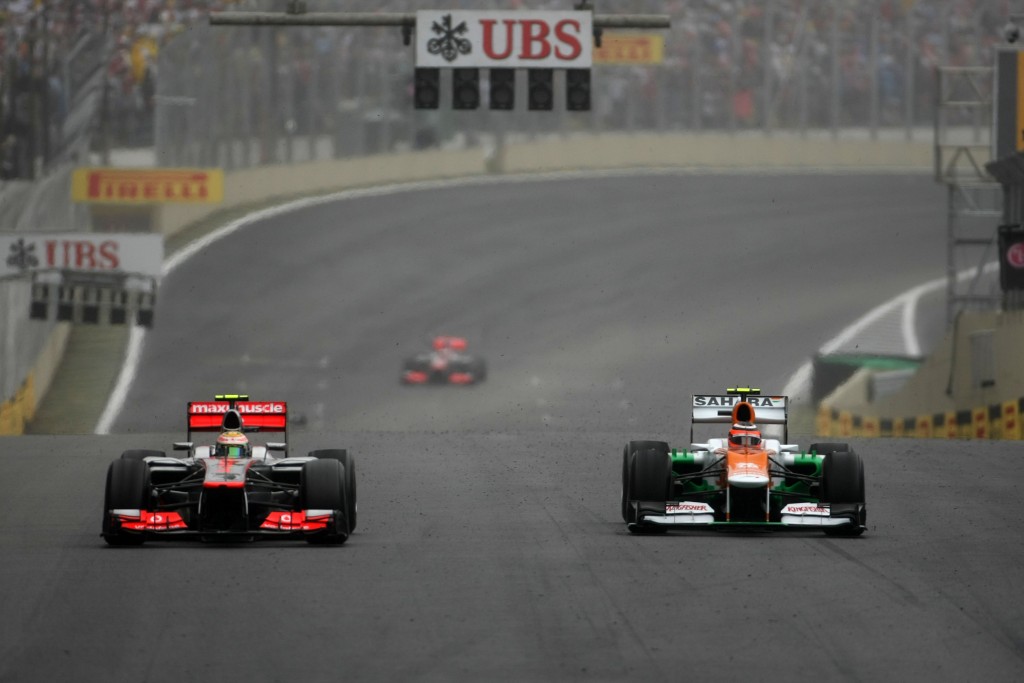 Lewis Hamilton (GBR) McLaren MP4/27 battles with Nico Hulkenberg (GER) Sahara Force India F1 VJM05. Brazilian Grand Prix, Sunday 25th November 2012. Sao Paulo, Brazil.