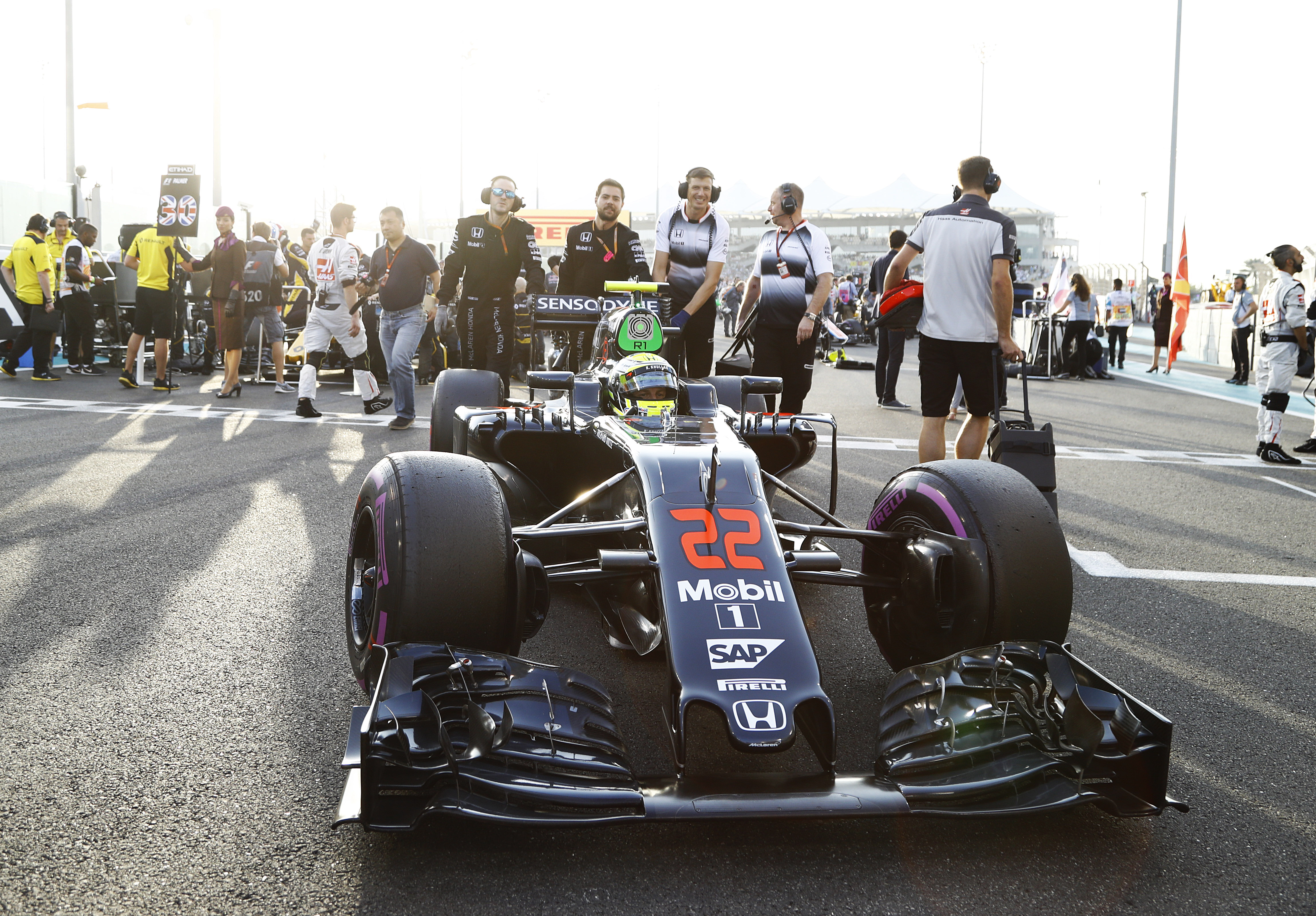 Jenson Button arrives on the grid.